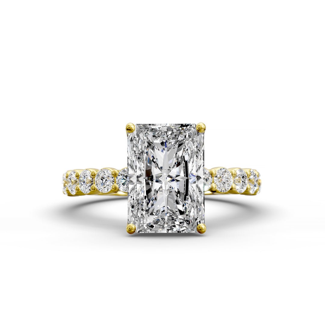 Radiant cut hidden halo engagement ring with seamless prong setting and pave band
