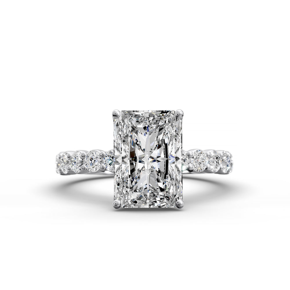 Radiant cut hidden halo engagement ring with seamless prong setting and pave band