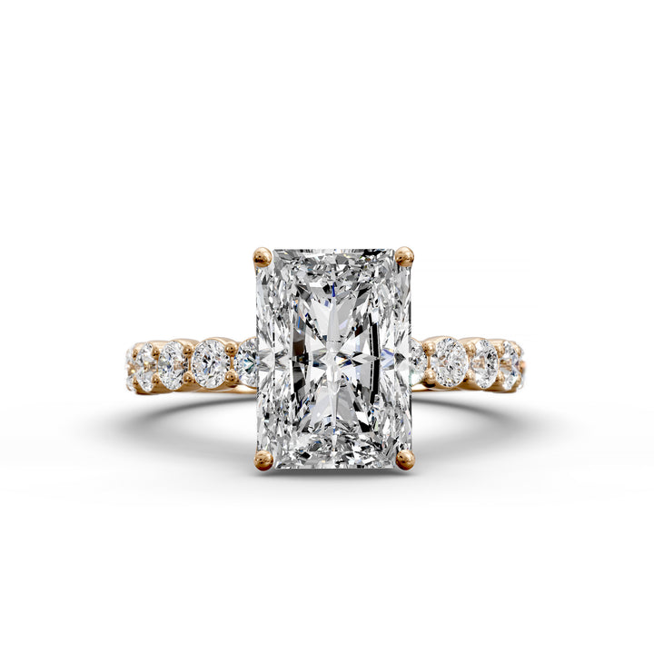 Radiant cut hidden halo engagement ring with seamless prong setting and pave band
