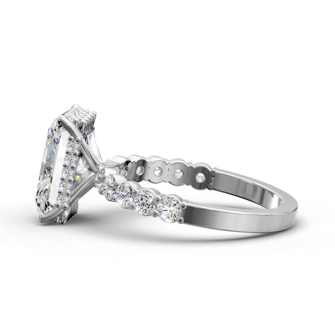 Radiant cut hidden halo engagement ring with seamless prong setting and pave band