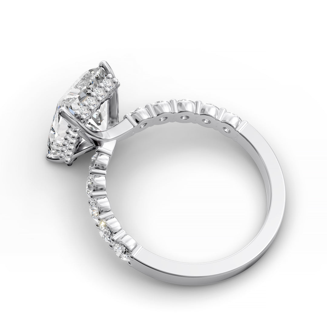 Radiant cut hidden halo engagement ring with seamless prong setting and pave band