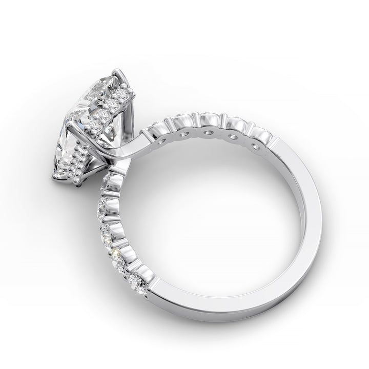 Radiant cut hidden halo engagement ring with seamless prong setting and pave band