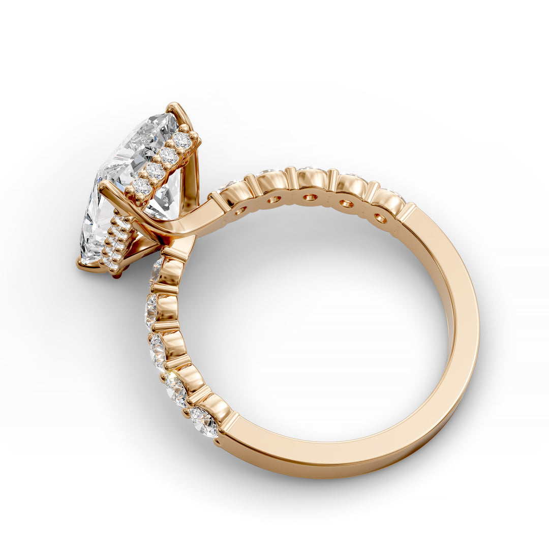 Radiant cut hidden halo engagement ring with seamless prong setting and pave band