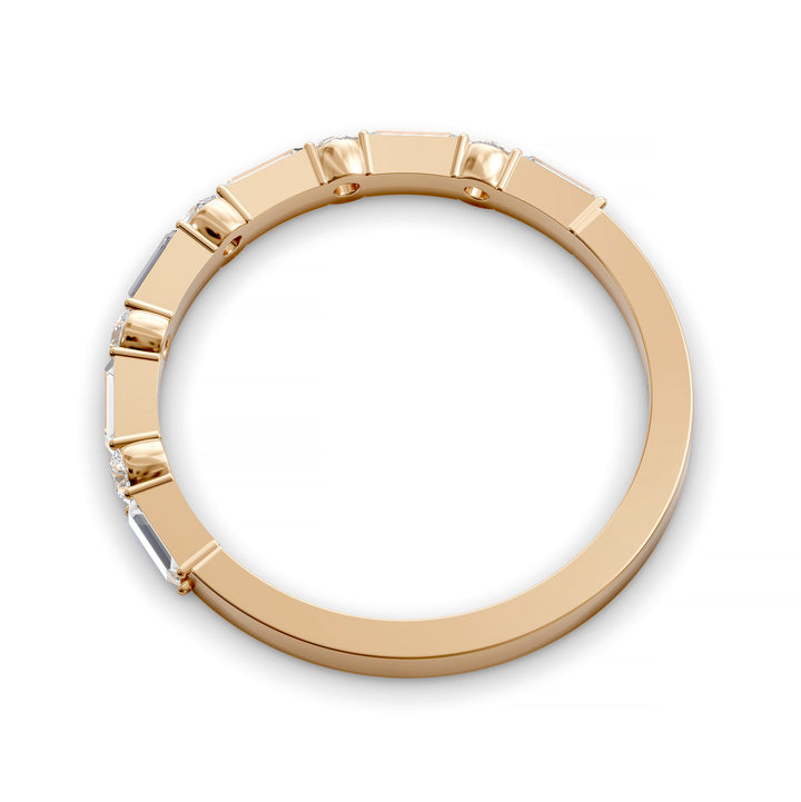 Modern gold wedding band with alternating round and baguette-cut diamonds