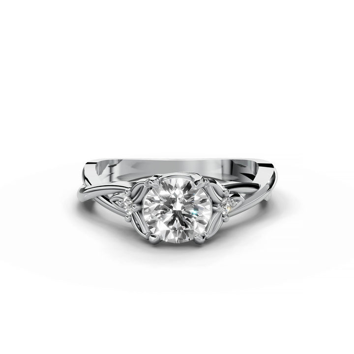 Round diamond engagement ring, nature-inspired design, split band, white gold.