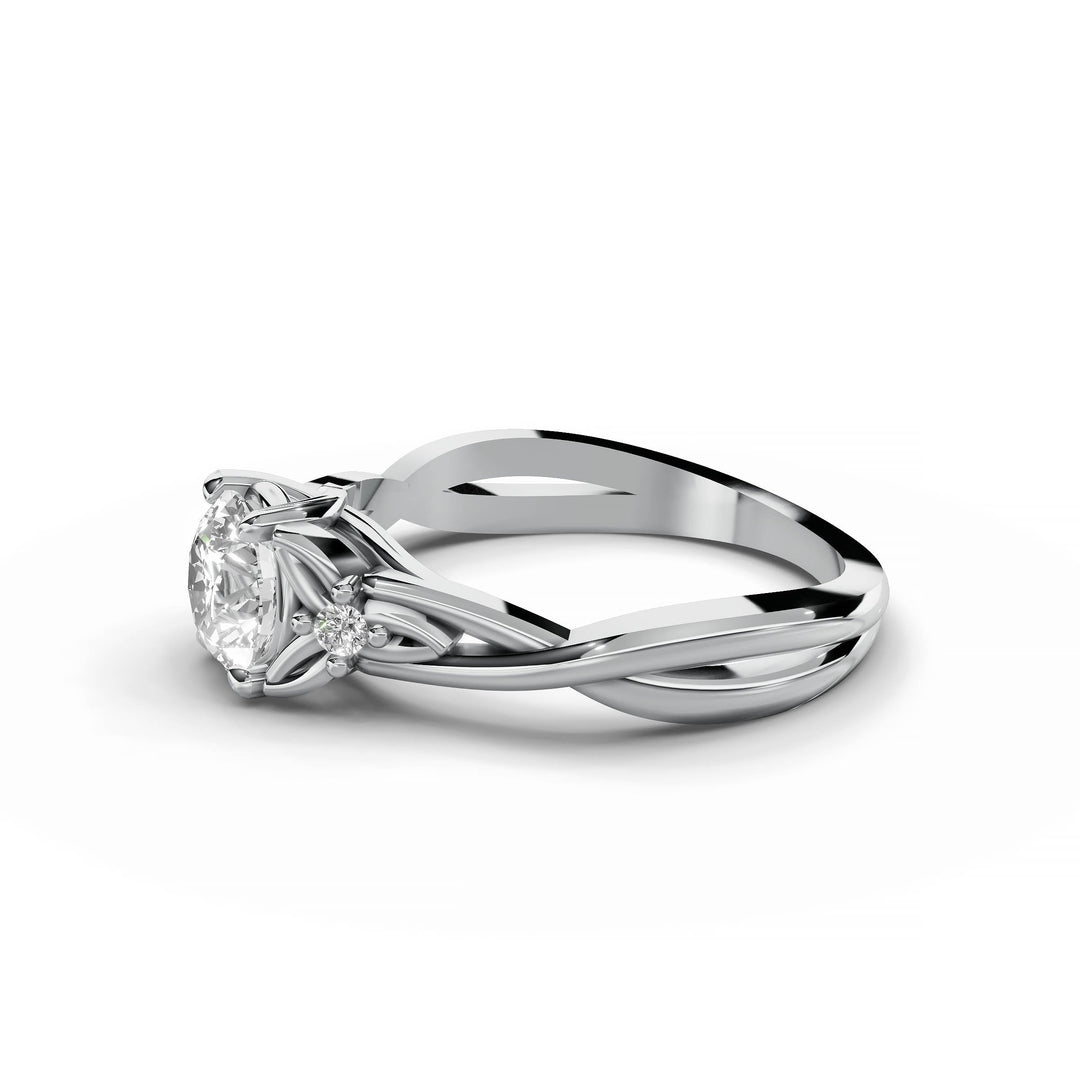 Round diamond engagement ring, nature-inspired design, split band, white gold.