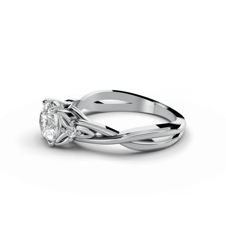 Round diamond engagement ring, nature-inspired design, split band, white gold.