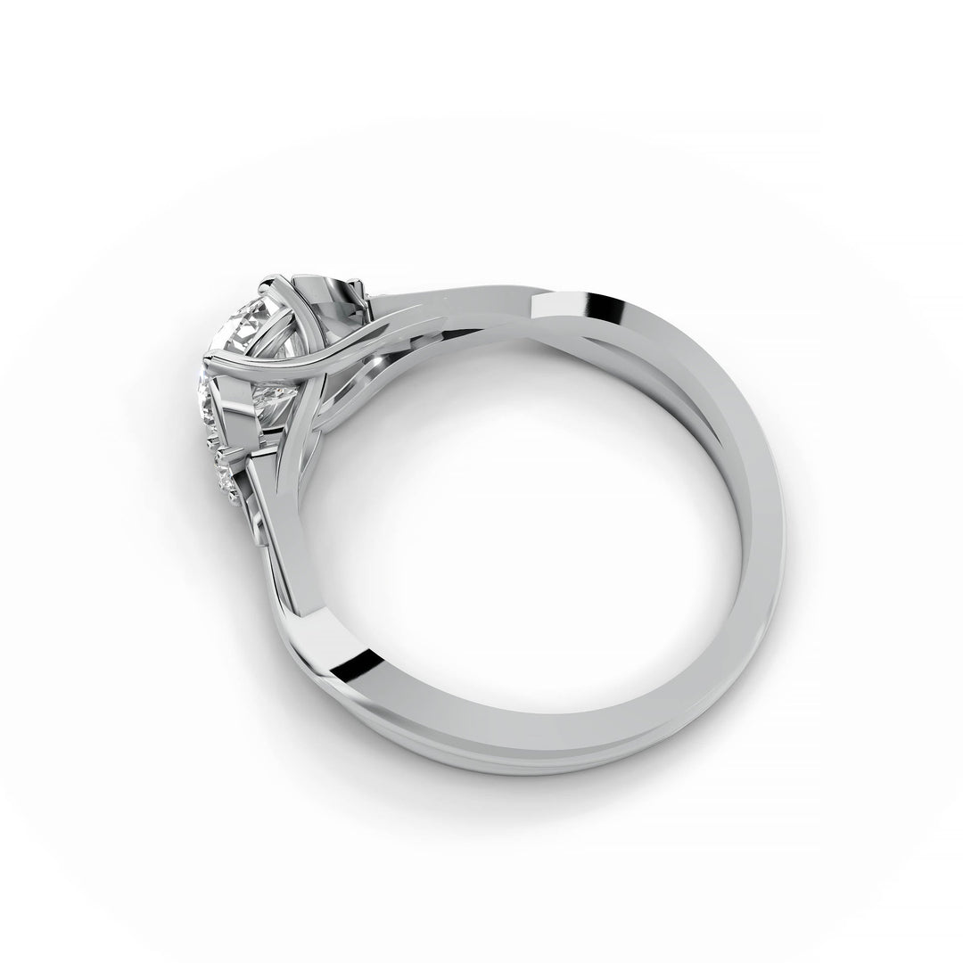 Round diamond engagement ring, nature-inspired design, split band, white gold.