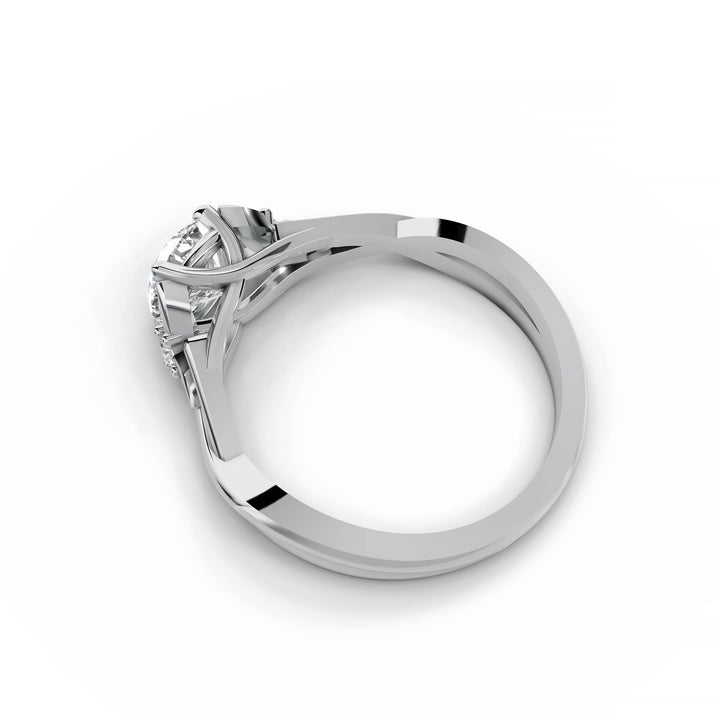 Round diamond engagement ring, nature-inspired design, split band, white gold.