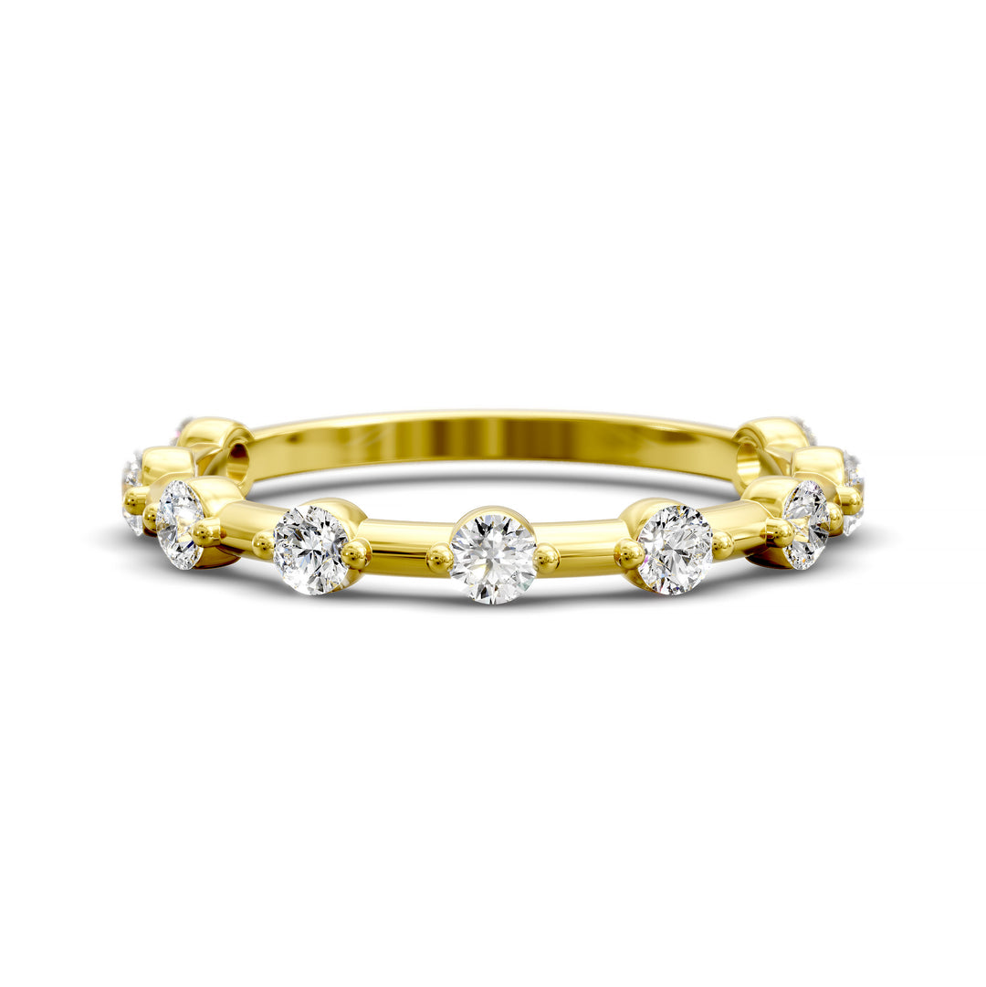 Shared prong eternity wedding band with spaced round diamonds