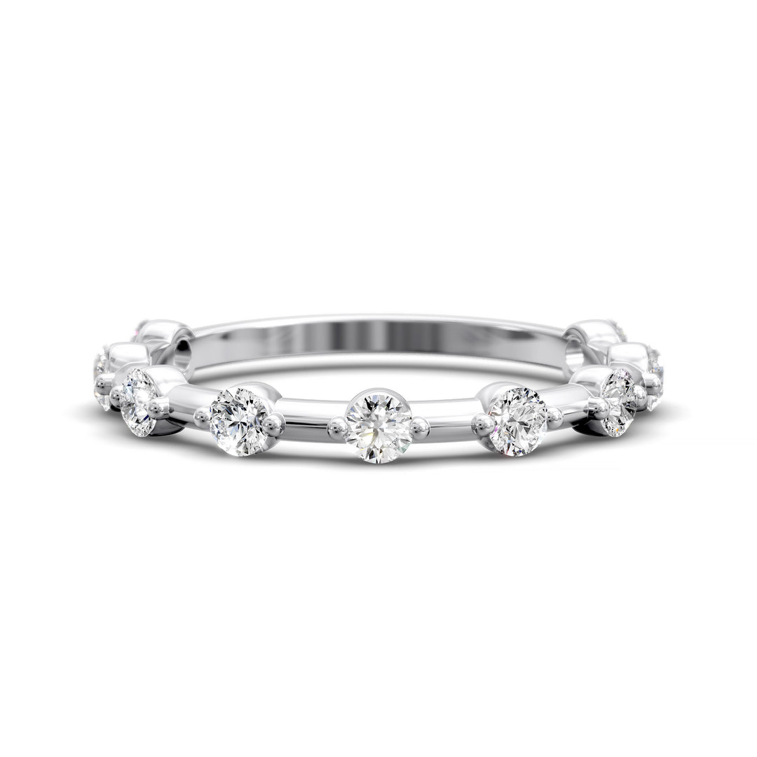 Shared prong eternity wedding band with spaced round diamonds