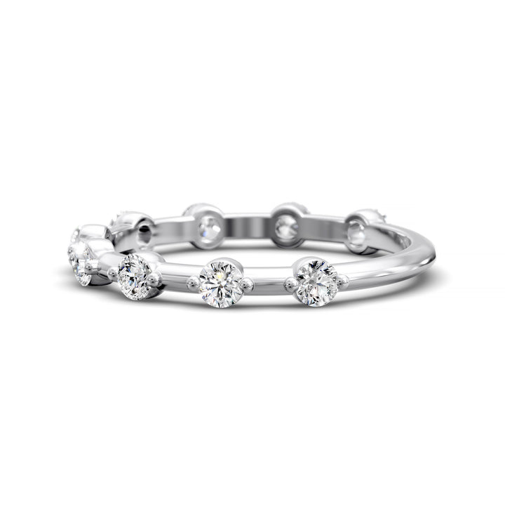 Shared prong eternity wedding band with spaced round diamonds