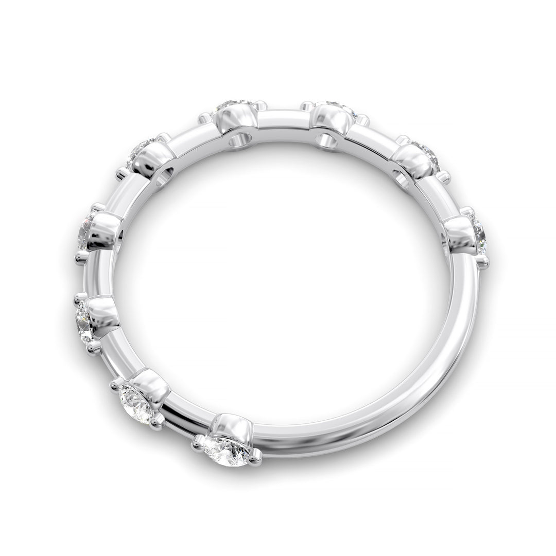Shared prong eternity wedding band with spaced round diamonds