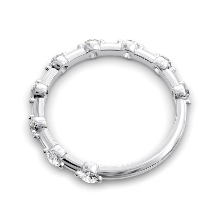 Shared prong eternity wedding band with spaced round diamonds