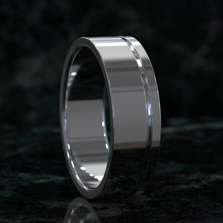 flat profile men’s wedding band with single polished edge design