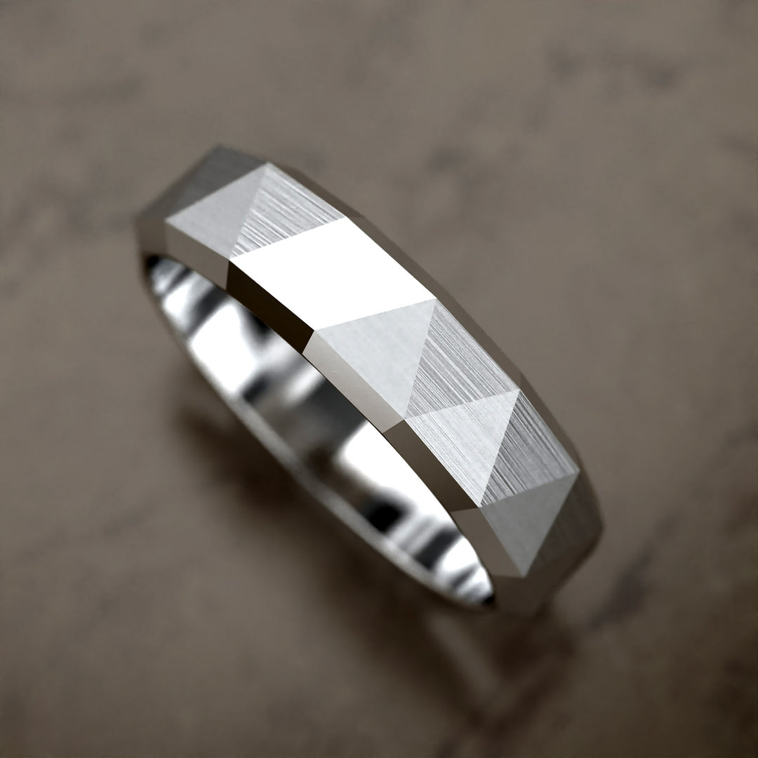faceted geometric band with brushed triangular pattern