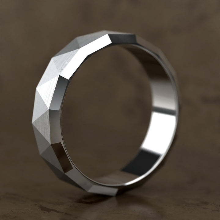 faceted geometric band with brushed triangular pattern
