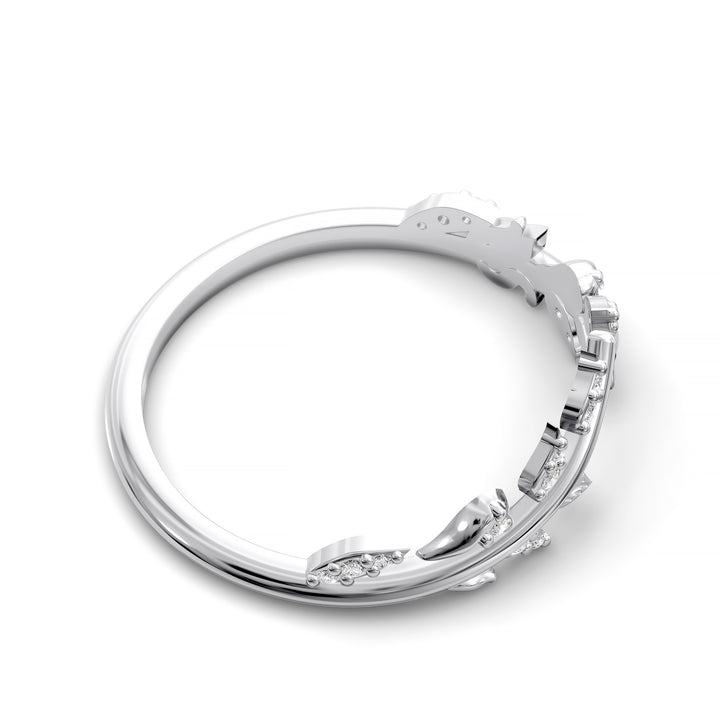 V-shaped nature-inspired wedding band with leaf motifs and round stones