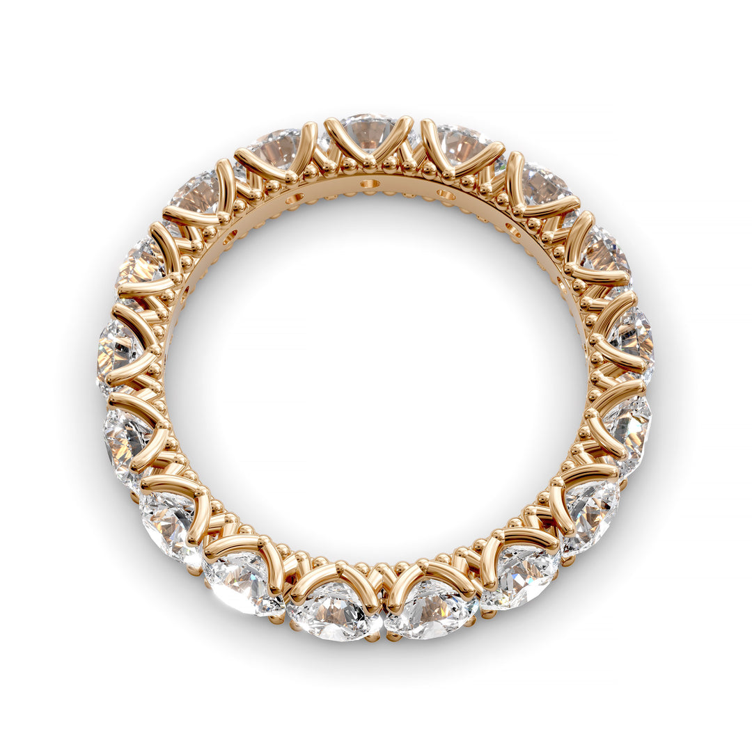 Vintage-inspired eternity band with round cut diamonds and intricate scalloped setting