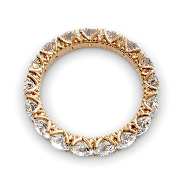 Vintage-inspired eternity band with round cut diamonds and intricate scalloped setting